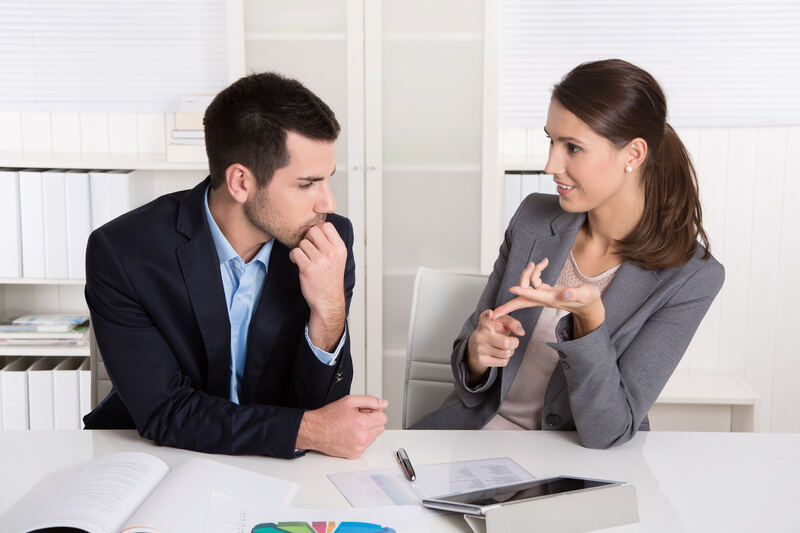 A team of young professionals collaborating around a table
